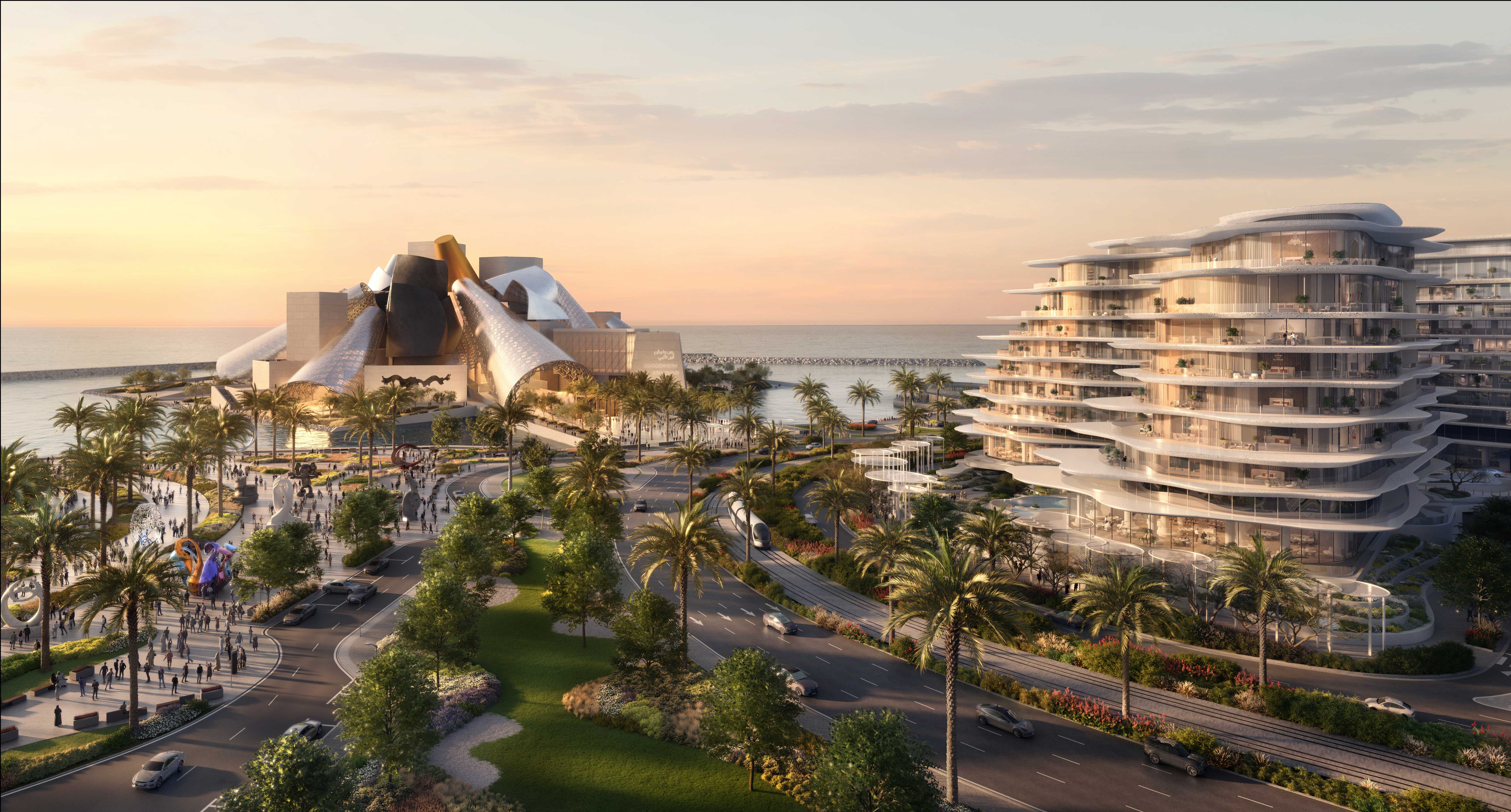 Aerial sunset view of Baccarat Residences Saadiyat, showing the sculptural white terraced building beside a palm-lined boulevard with a tram line, situated near the Guggenheim Abu Dhabi museum on the waterfront.
