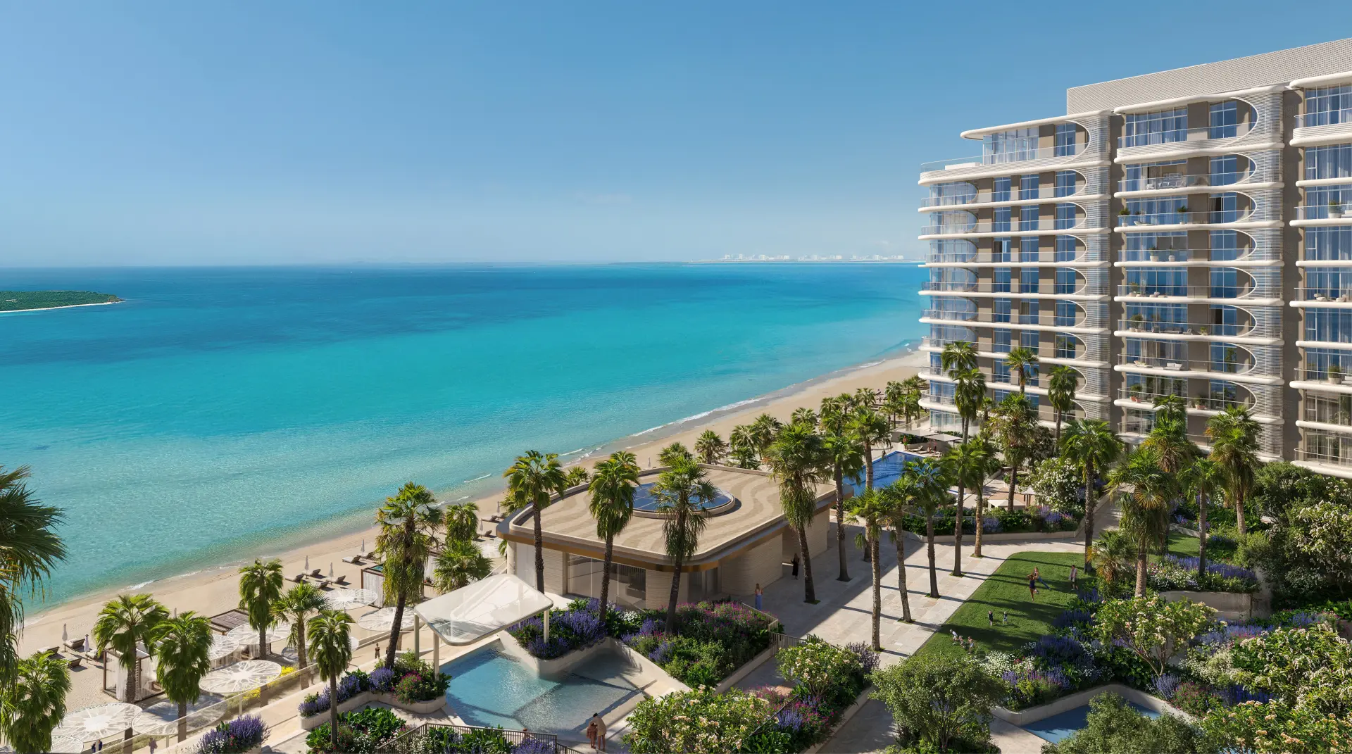 Aerial view of Fahid Beach Terraces high-rise residential building with curved balconies overlooking a beachfront, featuring landscaped grounds, swimming pools, palm trees, and direct beach access along turquoise waters.